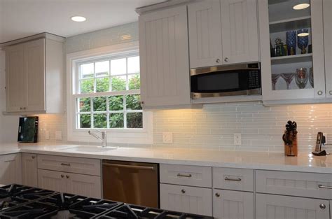 A tile wet saw makes this tile backsplash project much faster and easier…with better results than other. Vertical White Glass Subway Tile Backsplash