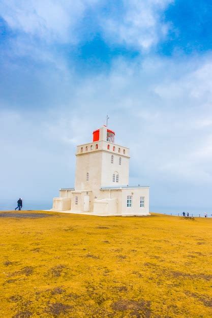 Free Photo White Lighthouse At Cape Dyrholaey Iceland