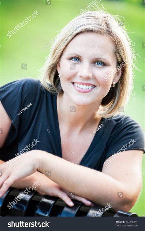Headshot Portrait Of An Early 30s Casual Happy Beautiful Blond Woman
