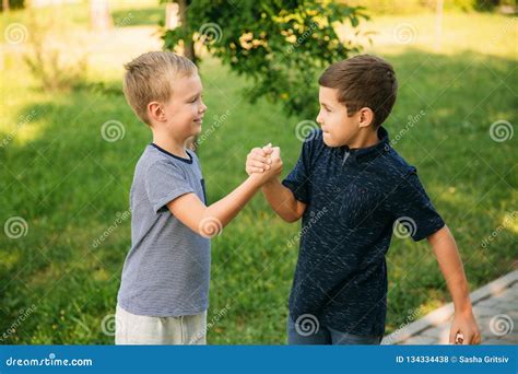 Two Boys Friends Spend Time In Park Children Models Stock Photo