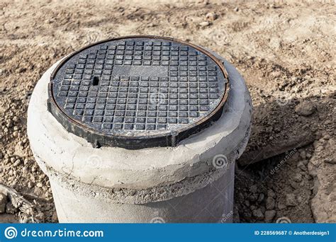 Installation Of A Road Metal Hatch In A Concrete Well Close Up Road