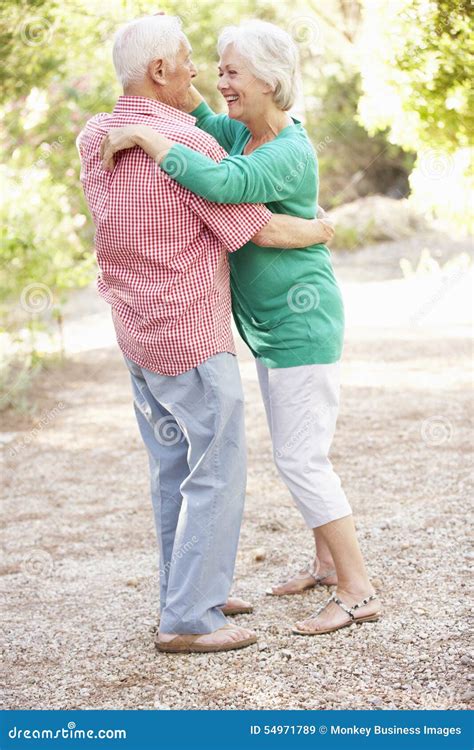 Senior Couple Dancing In Countryside Together Stock Image Image Of