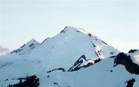 Download Wallpaper 1440x900 Mountain Peak Snow Snowy Landscape