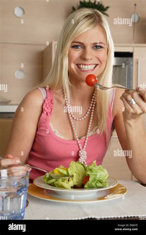 Blond Woman In The Kitchen Blonde Frau In Der Kueche Stock Photo Alamy