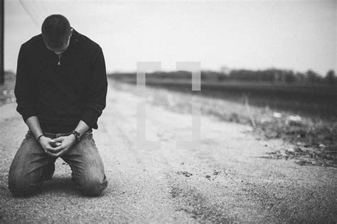 Man Kneeling In Prayer In The Middle Of A Rural — Photo