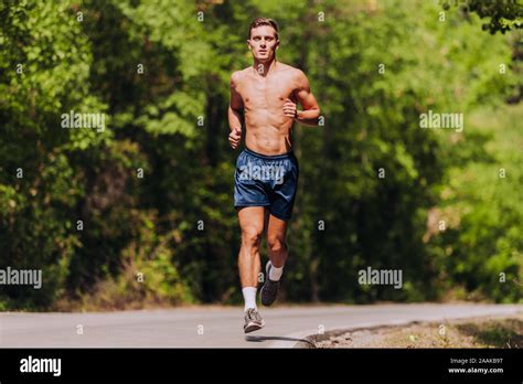 Running Man Male Runner At Sprinting Speed Training For Marathon