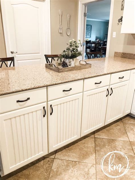 Our kitchen was way too dark with red walls, wood cabinets, and wood flooring. Painted beadboard kitchen cabinets in Sherwin Williams ...