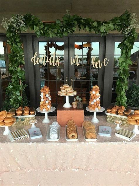 donut wedding dessert display dessert display of donut towers {joyeux events} in 2020