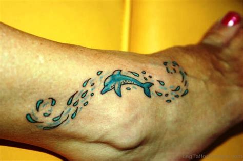 24 Attractive Dolphin Tattoos On Foot Leg Tattoo Designs