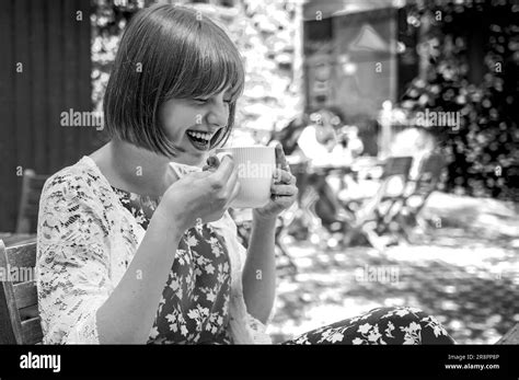 Happy Teenage Girl With Cup Drinking Cocoa At City Street Cafe Terrace Drinks And People