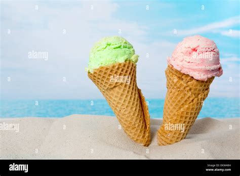 Funny Image Of Two Ice Cream Cones In The Beach Sand Stock Photo Alamy