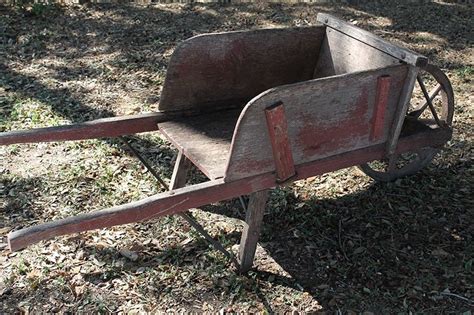 Old Fashioned Reproduction Wood And Metal Spoke Wheelbarrows With