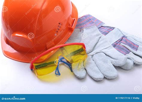Orange Hard Hat Goggles And Safety Gloves On A White Background Stock