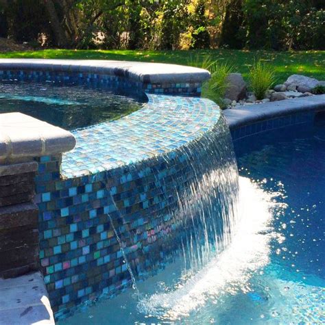 These Glass Pool Tile Spillways Are A Beautiful Way To Make Your Pool