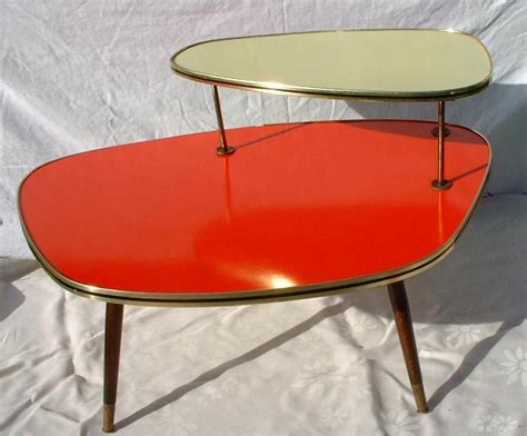 The orange coffee table is a much less common choice, but combining it with a touch of white along with décor in gray can give the living space a sophisticated and cheerful modern appeal. VINTAGE~MID-CENTURY~BOOMERANG~FORMICA~COFFEE TABLE~WEST ...
