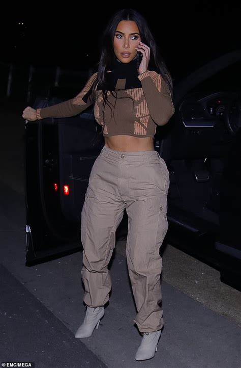 Kim Kardashian Puts Her Chiseled Abs Front And Center As She Takes A