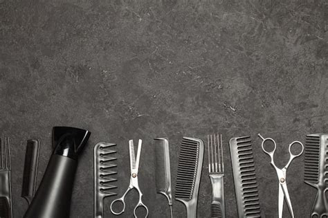 Premium Photo Black Combs And Combs With Scissors On A Black