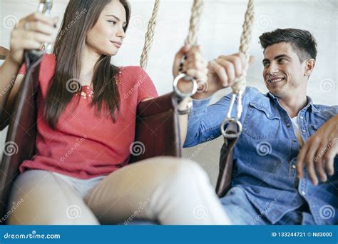 Young Couple Relaxing In Swing Stock Image Image Of Beautiful Carefree 133244721