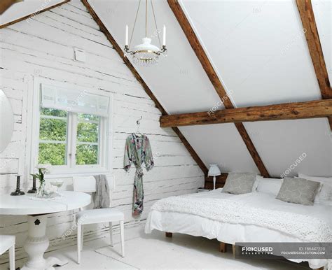 White Attic Bedroom In Rustic Style — Table Indoors Stock Photo