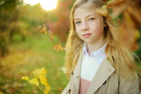Adorable Young Girl Having Fun On Beautiful Autumn Day Happy Child