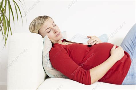 Pregnant Woman Sleeping On Sofa Stock Image F003 6025 Science Photo Library
