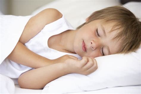 Young Boy Sleeping In Bed Stock Image Image Of Child 54943333