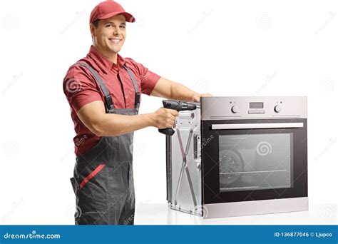 Repairman Working With A Drill On An Oven Stock Photo Image Of Home