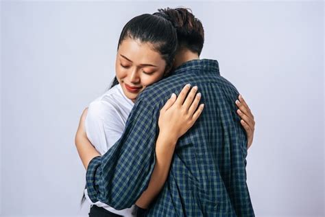 Free Photo Two Female Couples Standing And Hugging Each Other