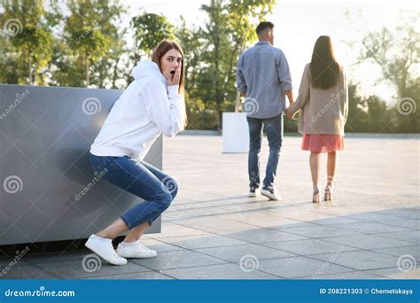 Jealous Ex Girlfriend Spying On Couple Outdoors Stock Image Image Of