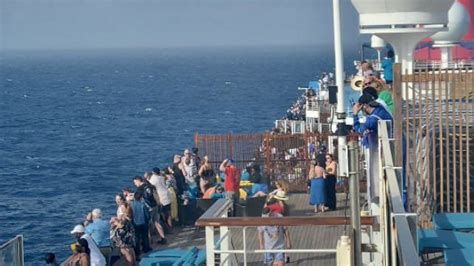 woman jumps off carnival cruise ship coast guard launches search as video capturing moments