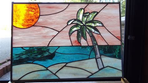 This unique sand dollar stained glass suncatcher is ready to be your reminder of what you love about the beach! Beach Sunset Stained Glass Panel. $250.00, via Etsy ...
