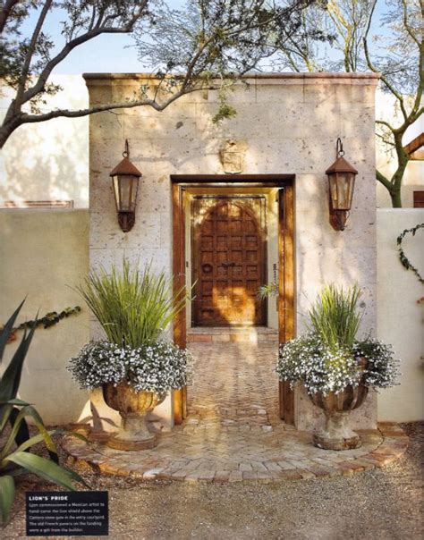 A small barbecue nook is conveniently accessed from the kitchen area, a perfect spot to enjoy the outdoors and the morning sunshine. French urns flank entry to Spanish-style courtyard; Palm ...