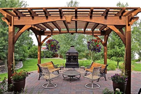 An enclosed gazebo that is built to stand up to harsh weather conditions. Install A DIY Timber Frame Pergola Over A Fireplace or ...