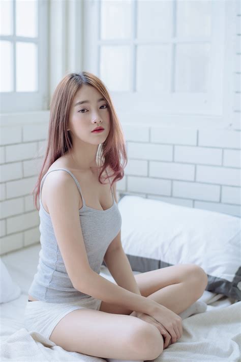 Crossed legs stock images from offset. Wallpaper : Asian, model, brunette, grey tops, in bed ...