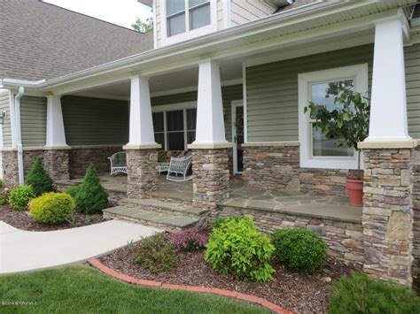 Beautiful Front Porch Made Of Stone With White Pillars Front Porch