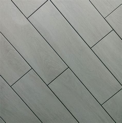 Combine Wood Effect Floor Tiles With Dark Grout For A Modern Floorboard