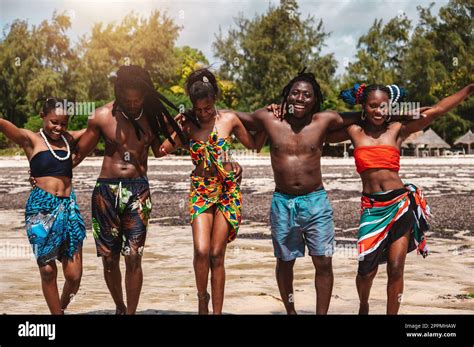 Kenyan People Dance On The Beach With Typical Local Clothes Stock Photo