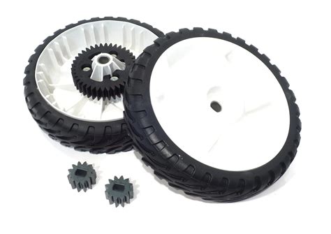 Two Black And White Wheels Are Next To Each Other On A White Surface