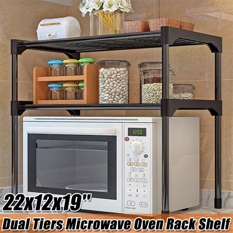 This kitchen organizer holds up to 100 pounds. Microwave Stand, Toaster Oven Rack , 2-Tier, Microwave ...