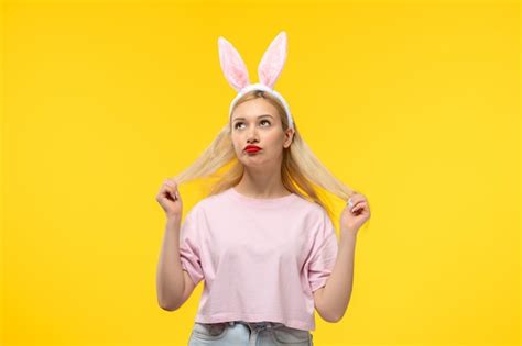 Free Photo Easter Lovely Blonde Adorable Girl With Pink Bunny Ears And Red Lipstick Stretching