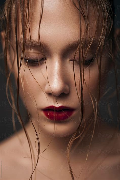 Portrait Of A Beautiful Girl With Wet Hair And Red Lips By Stocksy