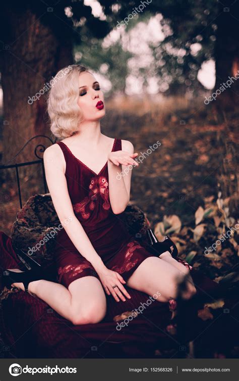 Beautiful And Elegant Blonde Woman With Red Lips And Hair
