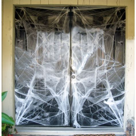 Mount the spider web by tying or taping the strings onto walls and other objects. Giant Spider Web - Halloween Decorations - HALLOWEEN