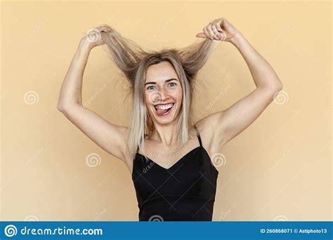 Cheerful Caucasian Young Woman Grimacing Fooling And Making Funny Faces During Photoshoot