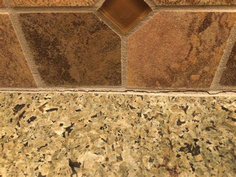 Removing cracked grout without damaging tile and granite ...
