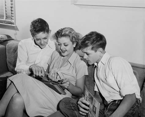 Angela Lansbury Looking Through A Scrapbook With Her Brothers Bruce Lansbury And His Twin
