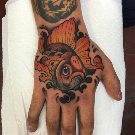 Neotraditional Goldfish Tattoo On The Right Hand