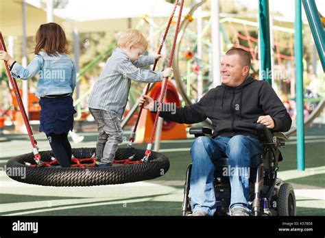 Disabled Father Play With His Little Son And Daughter Stock Photo Alamy