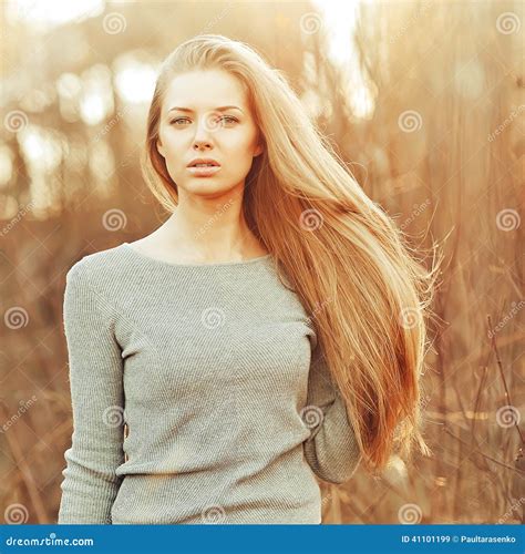 Attractive Young Blonde Woman With Perfect Long Chic Hair Stock Photo