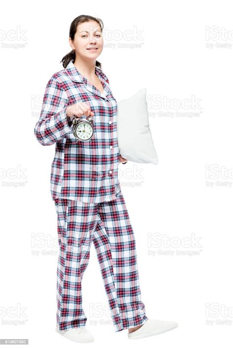 A 30 Year Old Woman Goes To Bed Carries A Pillow And An Alarm Clock On
